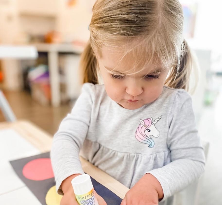 child gluing paper colors Child Gluing Paper Colors