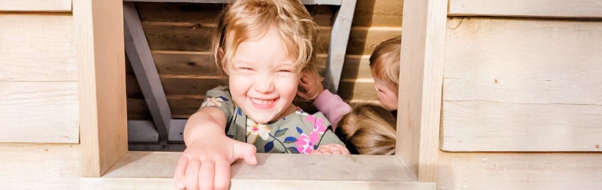 smiling children in window Smiling Children In Window