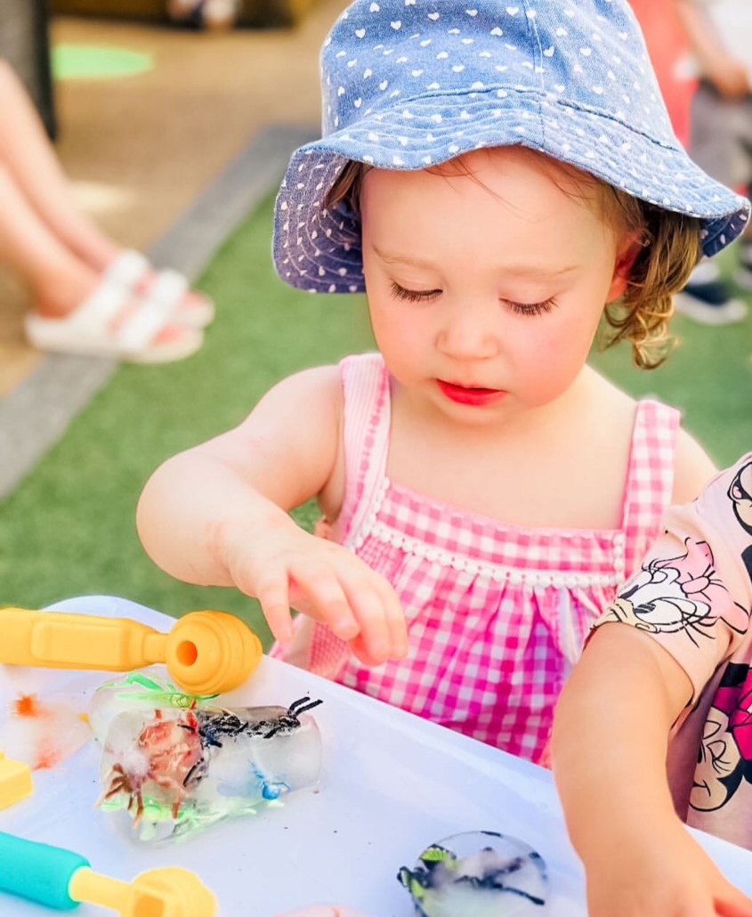 child-playing-with-ice-toys-daycare-activities Child Playing With Ice Toys Daycare Activities