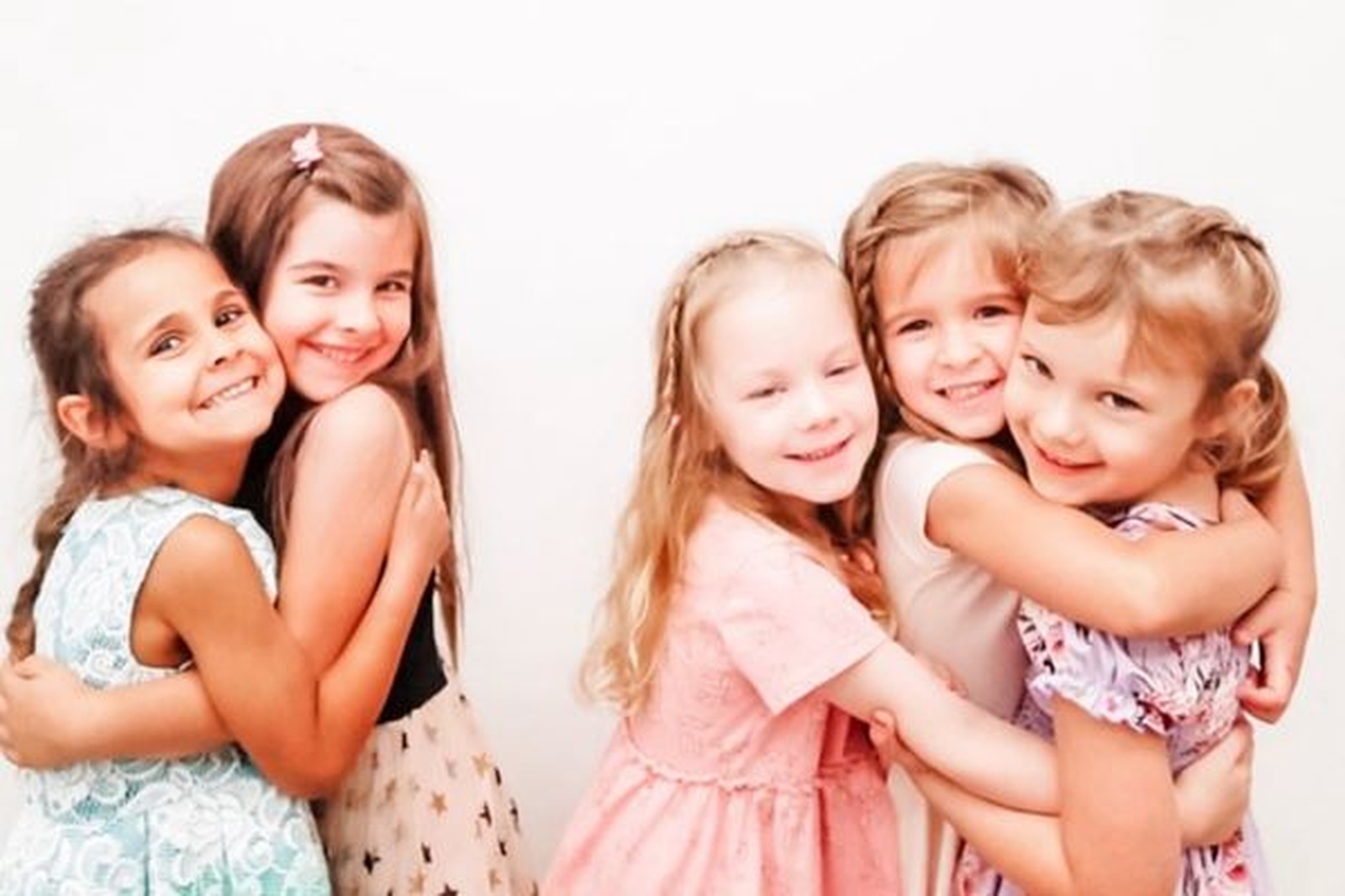 happy-girls-hugging-together-childcare-friendship-fun Happy Girls Hugging Together Childcare Friendship Fun